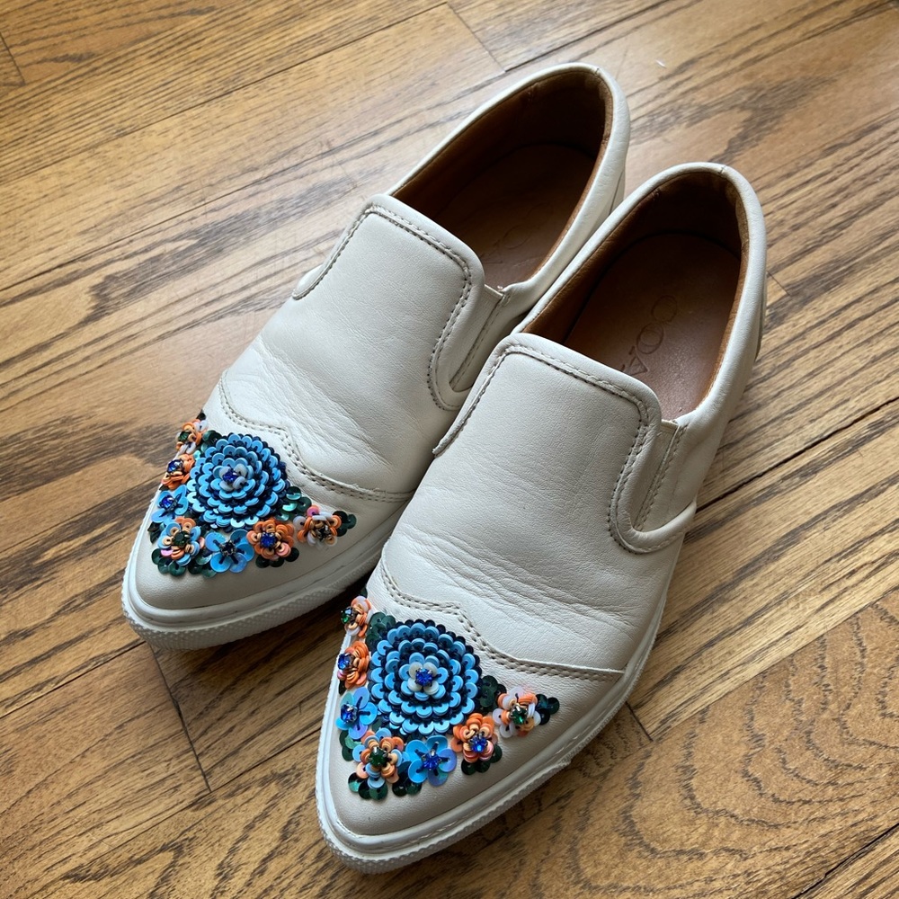 Coach white slip on sneakers